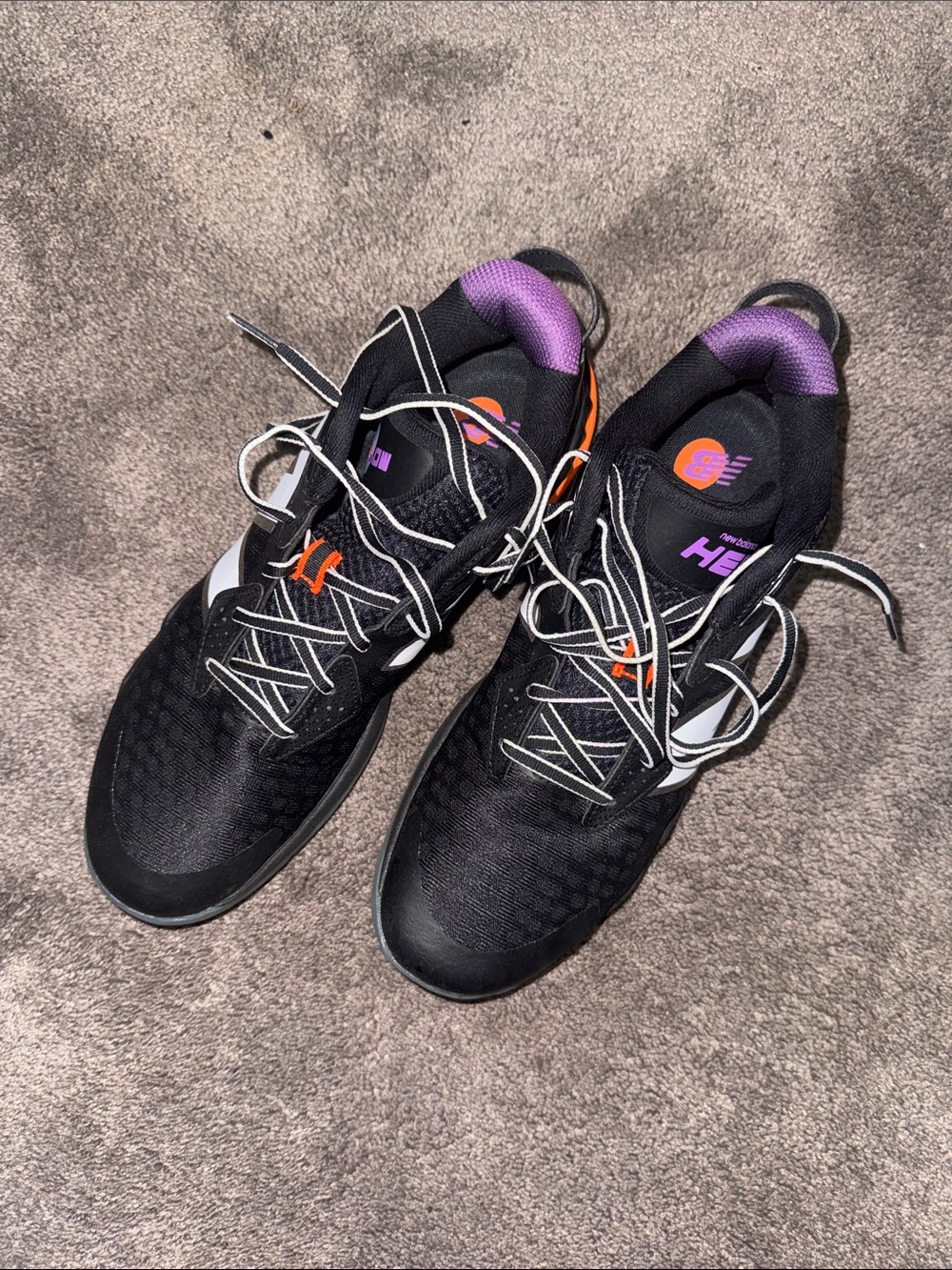New Balance Black Athletic Shoes with Purple and Orange Accents